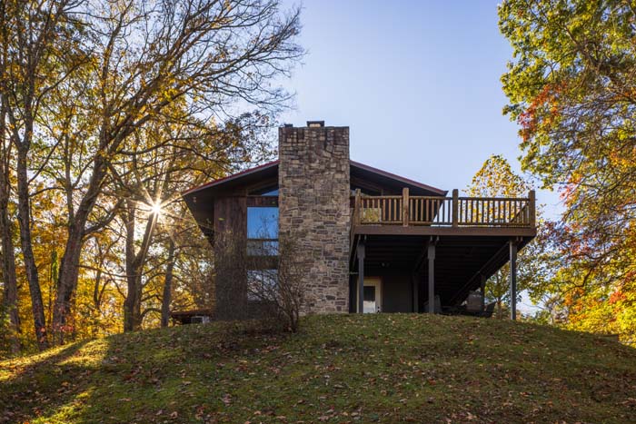 Rear of the lodge wing with stone chimney and deck at High Point Lodge