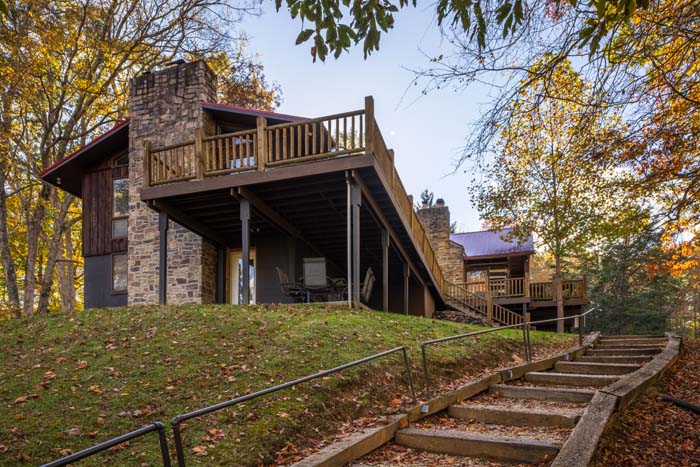 Lodge wing with stone chimney and steps up the lawn at High Point Lodge