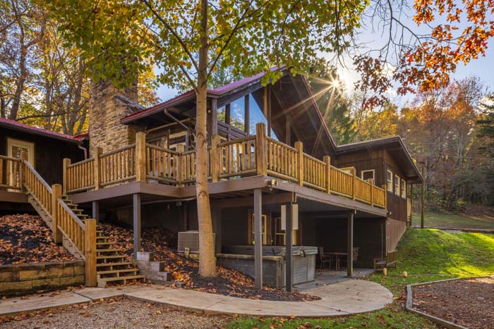 Lodge with log railed decks and stairs in fall at High Point Lodge
