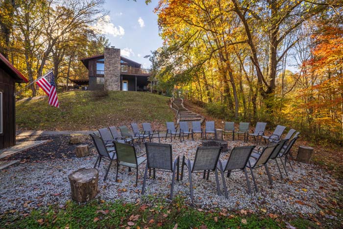 Fire pit with chairs near the pool house and lodge at High Point Lodge