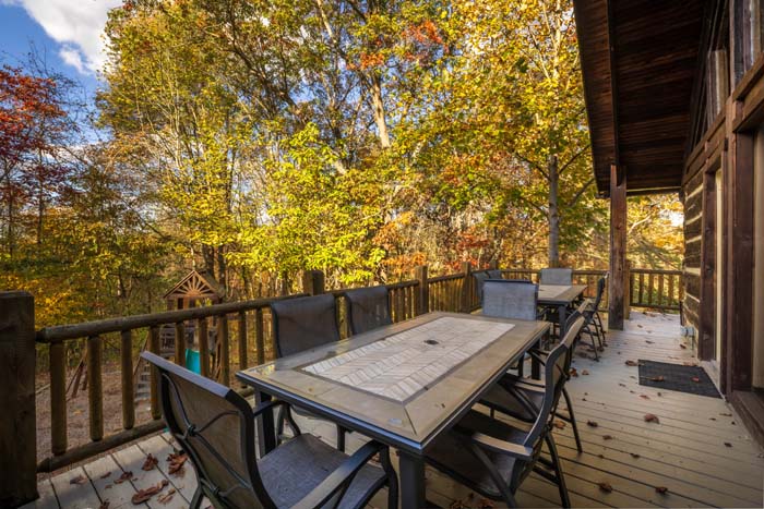 Deck with outdoor dining table and chairs at High Point Lodge