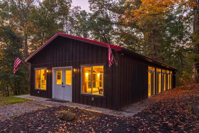 Pool house lit up at dusk at High Point Lodge