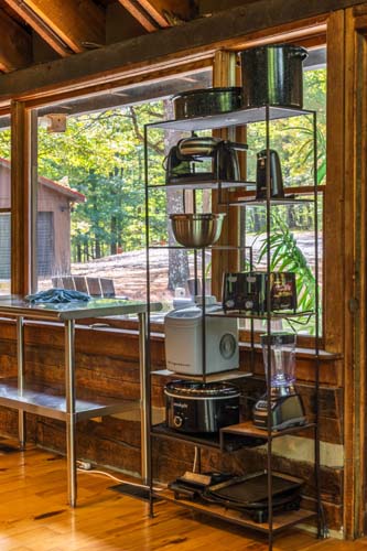 Open metal shelving with small appliances by the kitchen windows at High Point Lodge