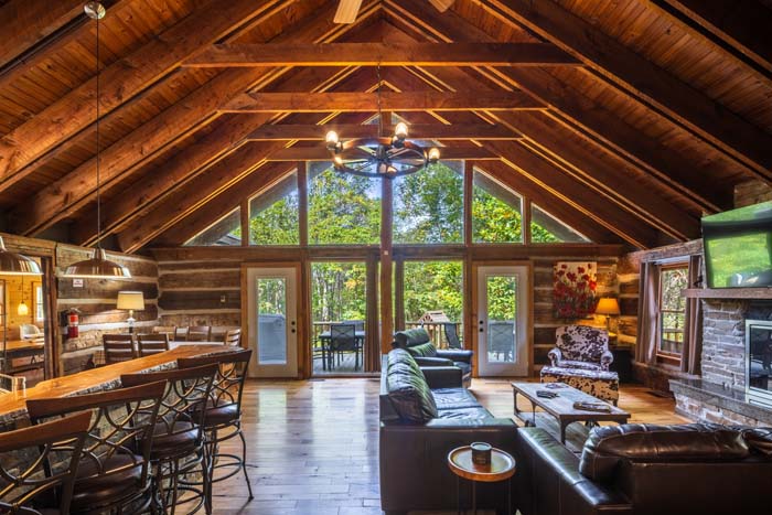 Great room and dining area under a vaulted wood ceiling at High Point Lodge