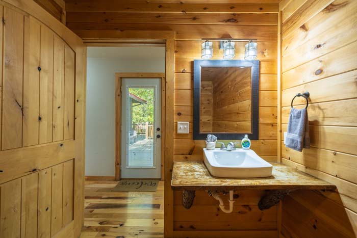 Bathroom vanity with vessel sink and mirror at High Point Lodge