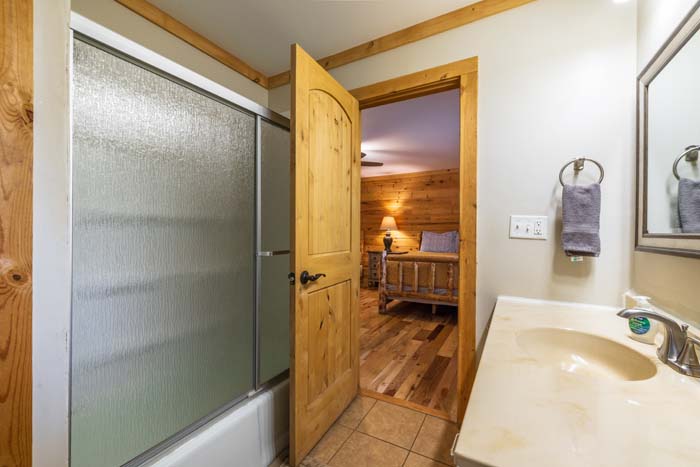 Bathroom with tub and shower and vanity at High Point Lodge