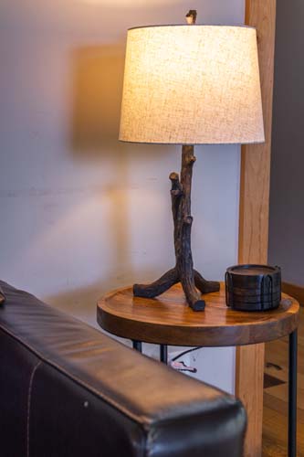 Table lamp beside the leather sofa at High Point Lodge