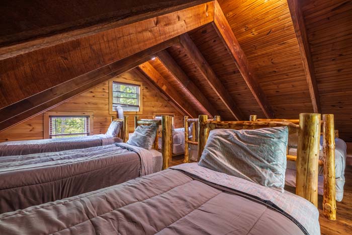 Twin log beds in the loft at High Point Lodge