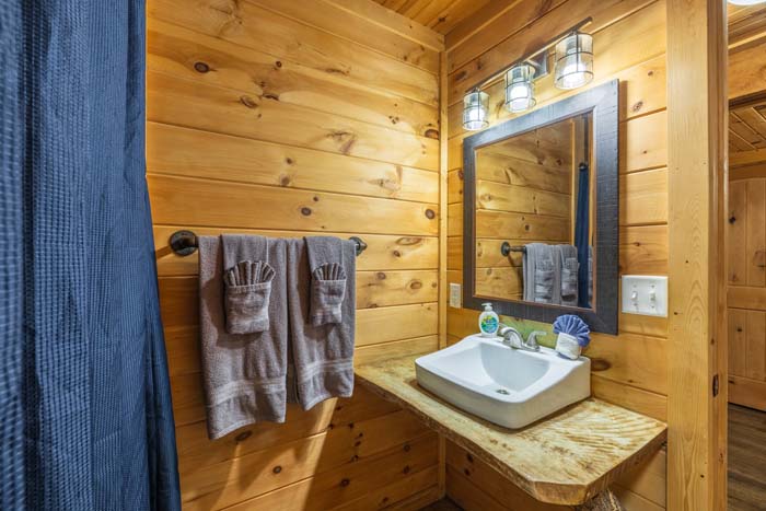 Bathroom vanity with vessel sink and towels at High Point Lodge