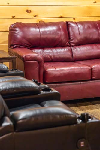Red leather sofa and black recliners at High Point Lodge