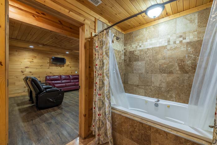 Bathroom with jetted tub opening to the lower level lounge at High Point Lodge
